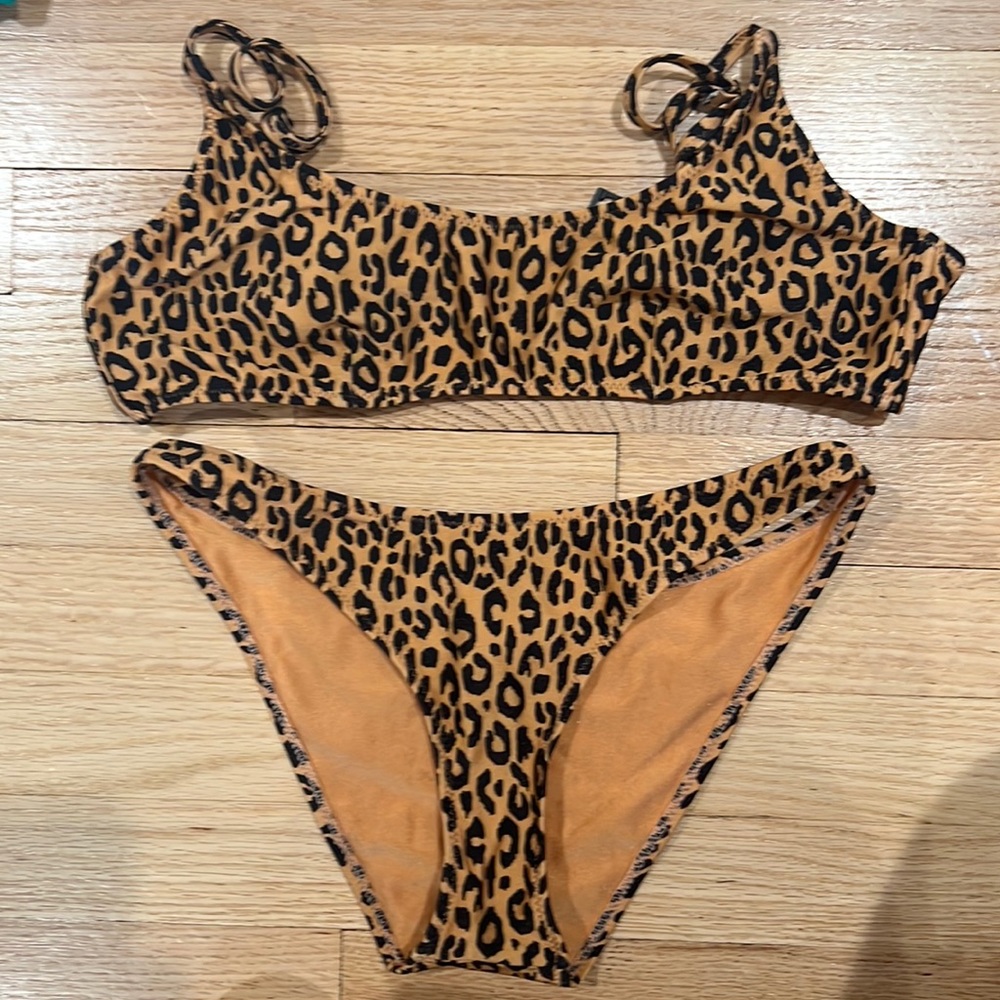 Triangl Bikini Cheetah Print. Top is a size large, and the bottoms are medium